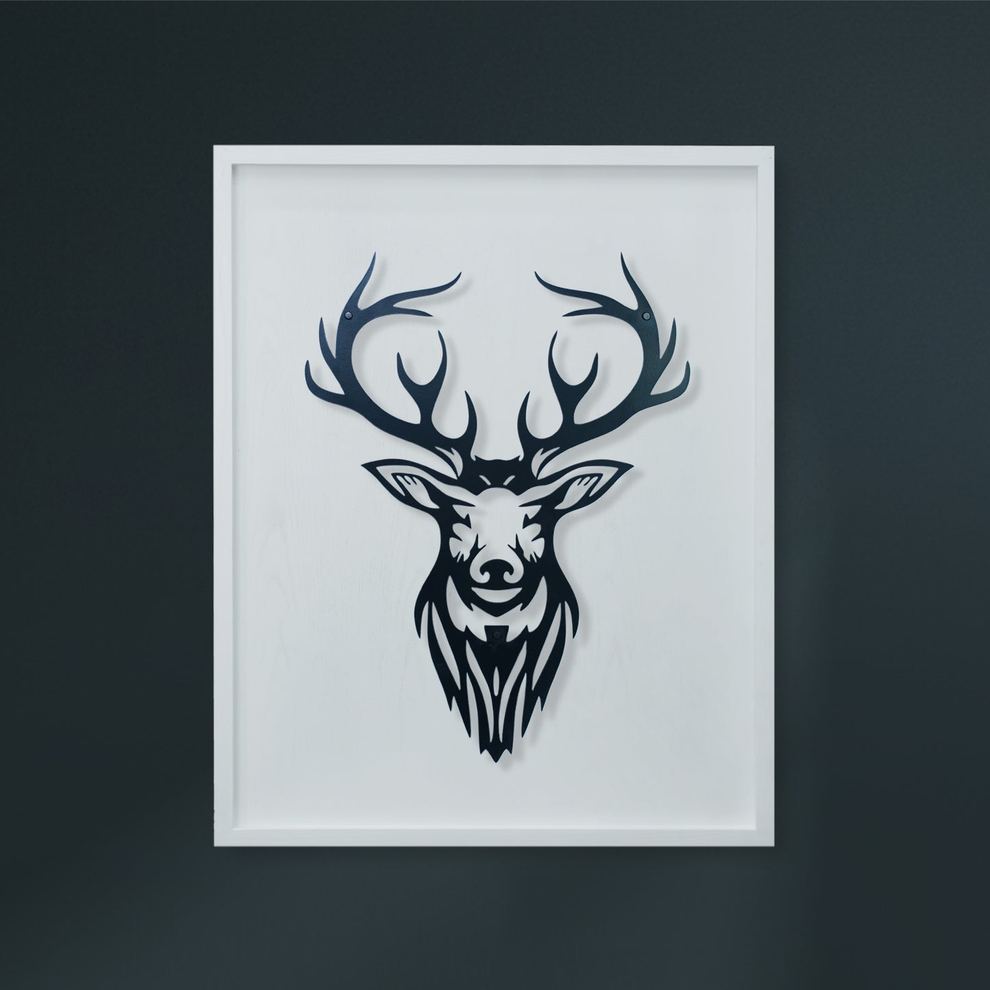 Framed black and white deer head art on a dark background