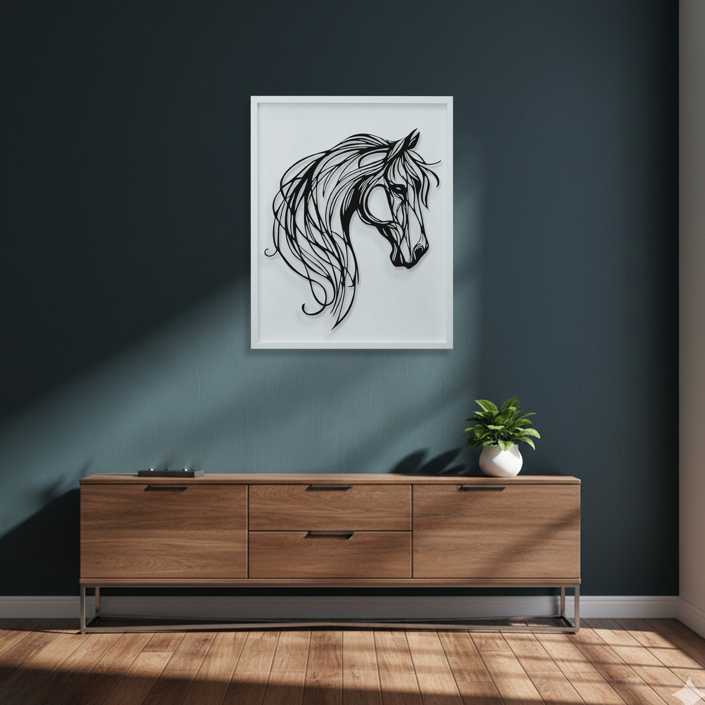 Framed black and white horse head artwork on a dark blue wall above a wooden console table.
