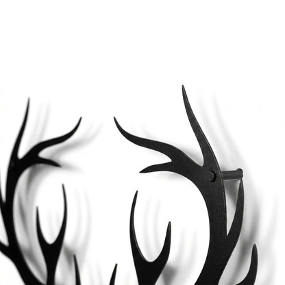 Black antler design on a white background
