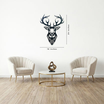 Black deer head wall decal on a white wall with two beige armchairs and a coffee table.
