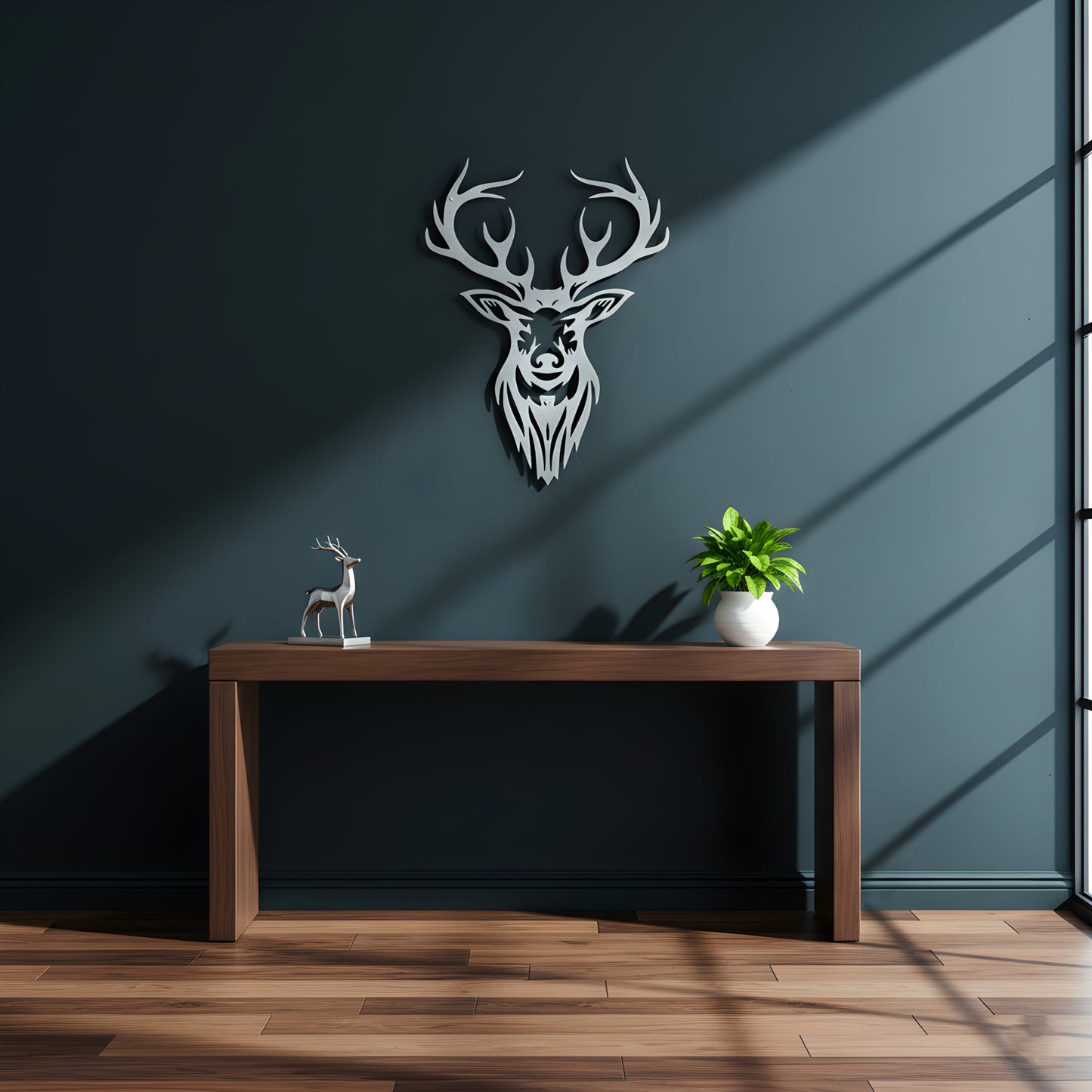 Decorative deer head wall art above a wooden table with a plant and small statue.
