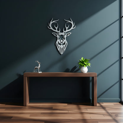 Decorative deer head wall art above a wooden table with a plant and small statue.