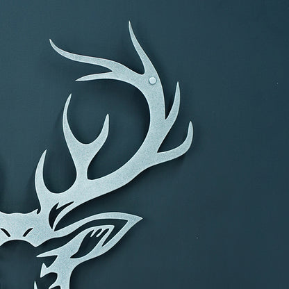 Metallic deer head with antlers on a dark blue background