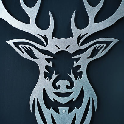 Metallic deer head cutout on a dark background