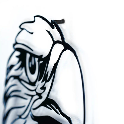 Black metal wall art of a stylized face of eagle on a white wall showing the shud
