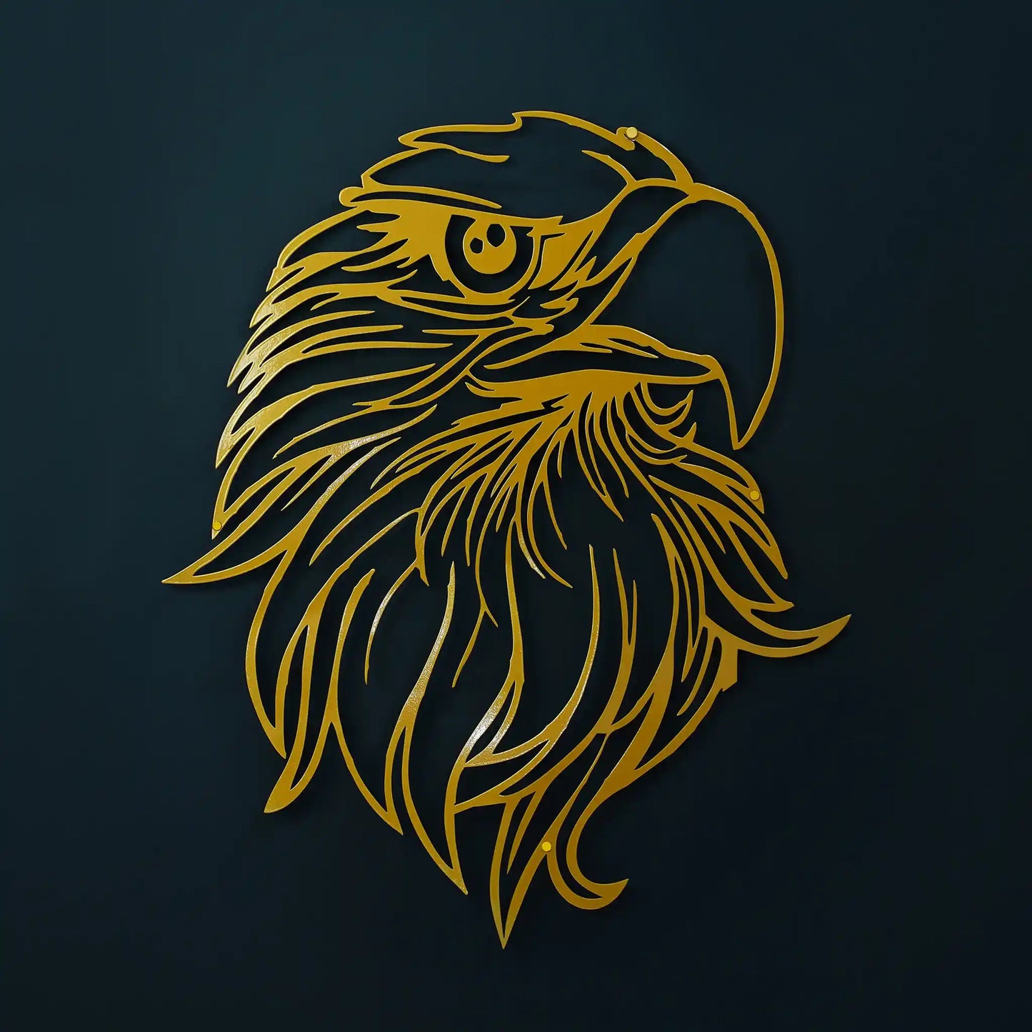 Gold eagle head in metal wall art on a black wall with soft shadow