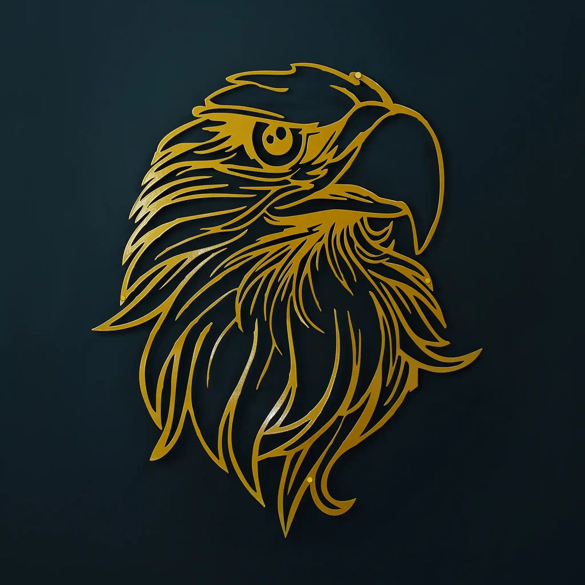 Gold eagle head in metal wall art on a black wall with soft shadow
