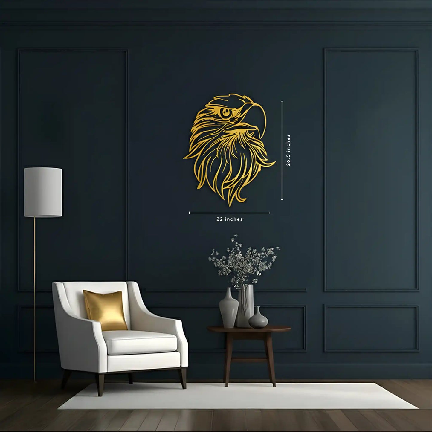 A gold metal wall wall decal of an eagle's head with dimension markings (20 inches by 26.5 inches) displayed on a dark navy blue paneled wall in a modern living room setting.