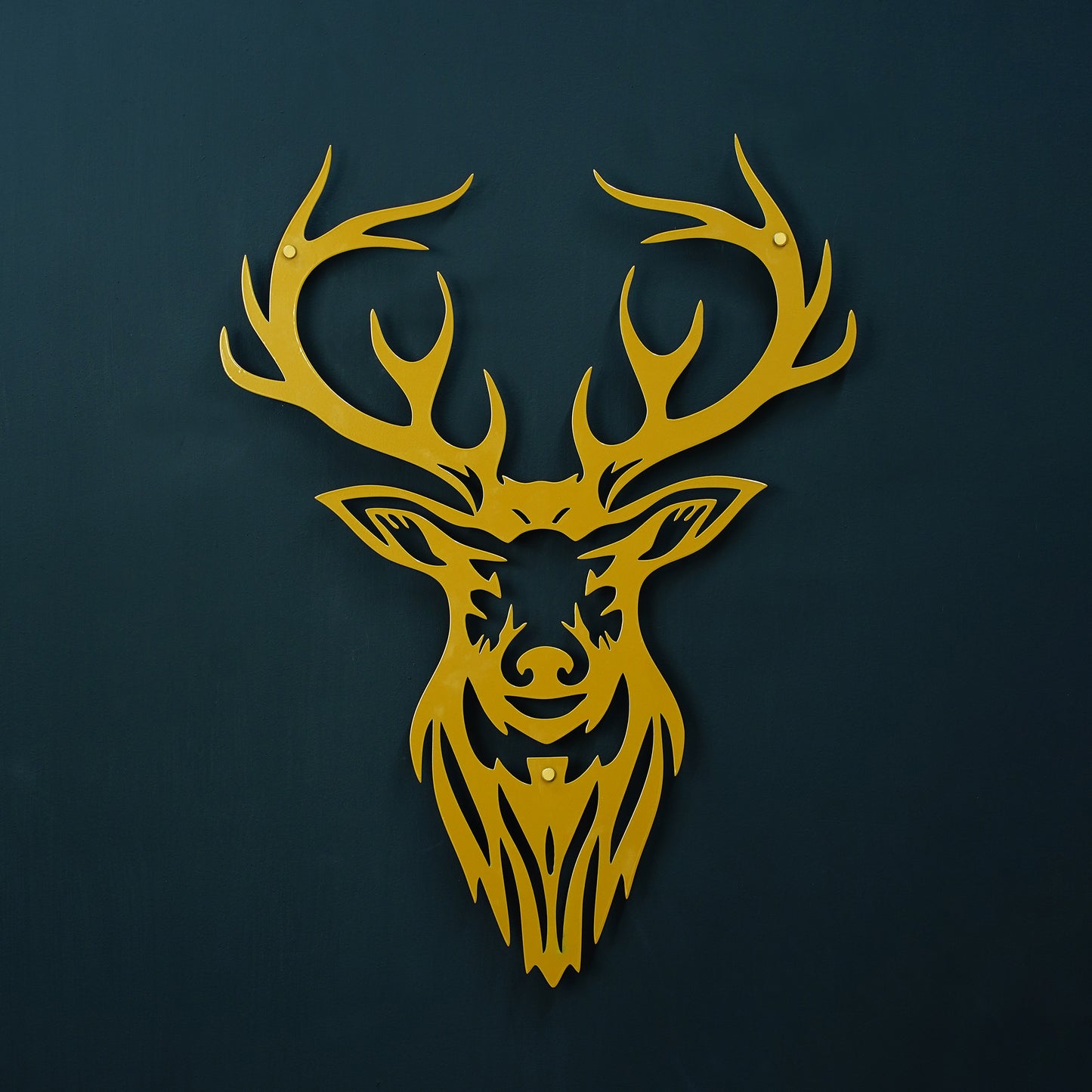 Gold deer head silhouette on a dark blue background