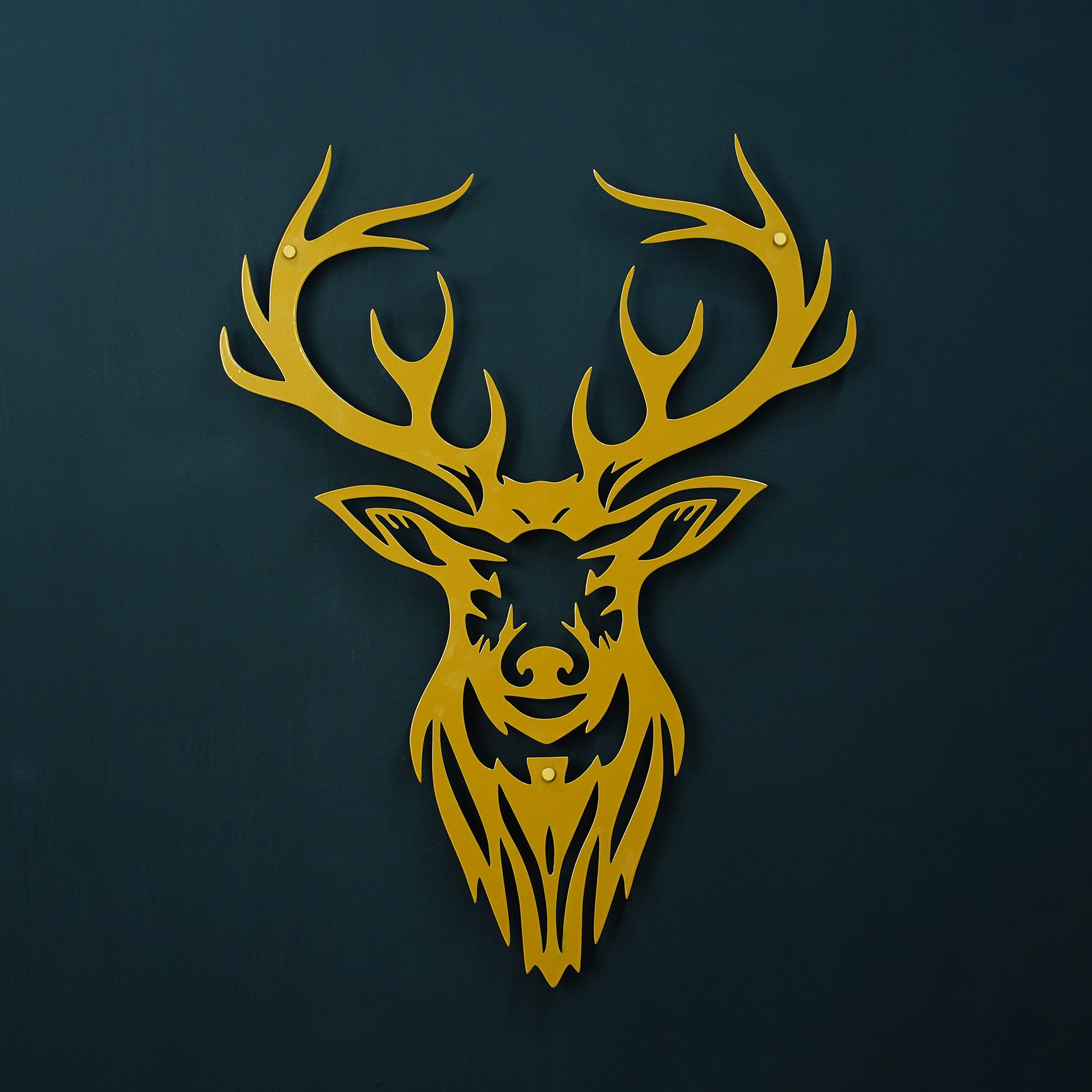 Gold deer head silhouette on a dark blue background