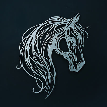 Decorative metal horse head sculpture on a black background