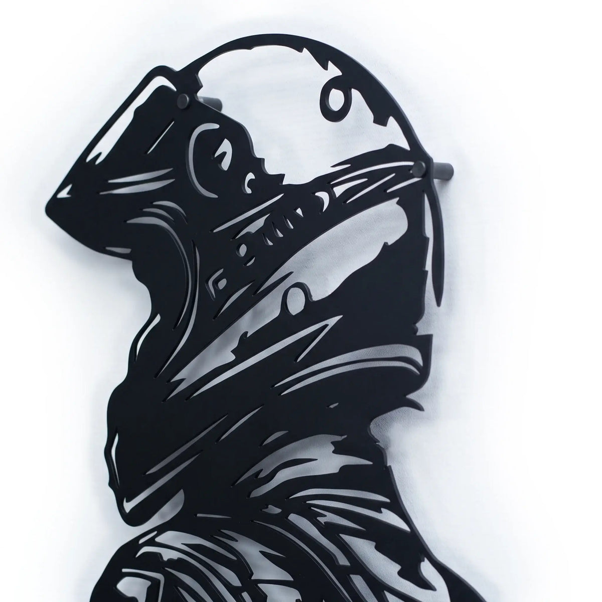 Side angle close-up of Racing Rider black metal wall art showing intricate laser-cut detail of rider helmet and gear