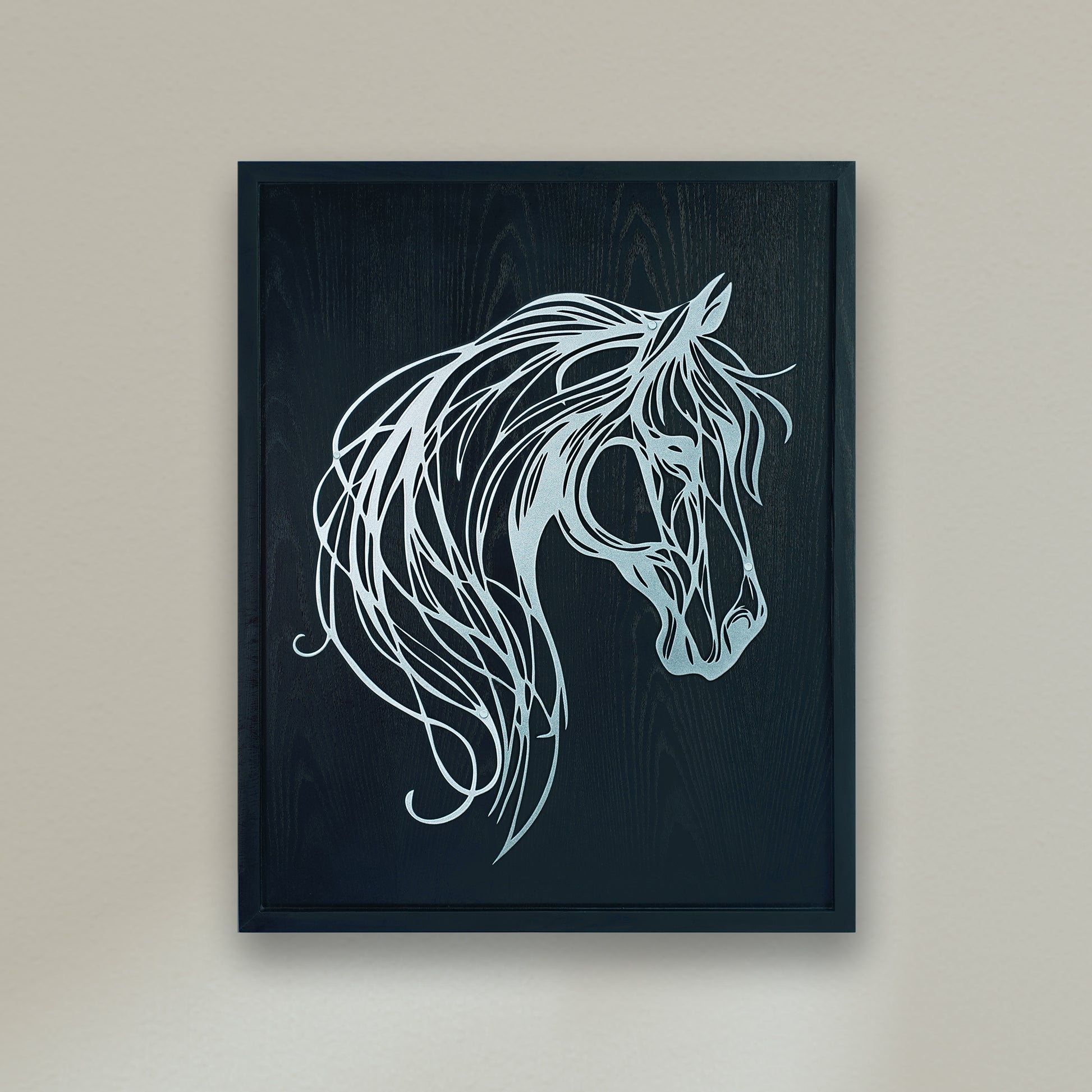 Framed artwork of a stylized horse head on a dark background