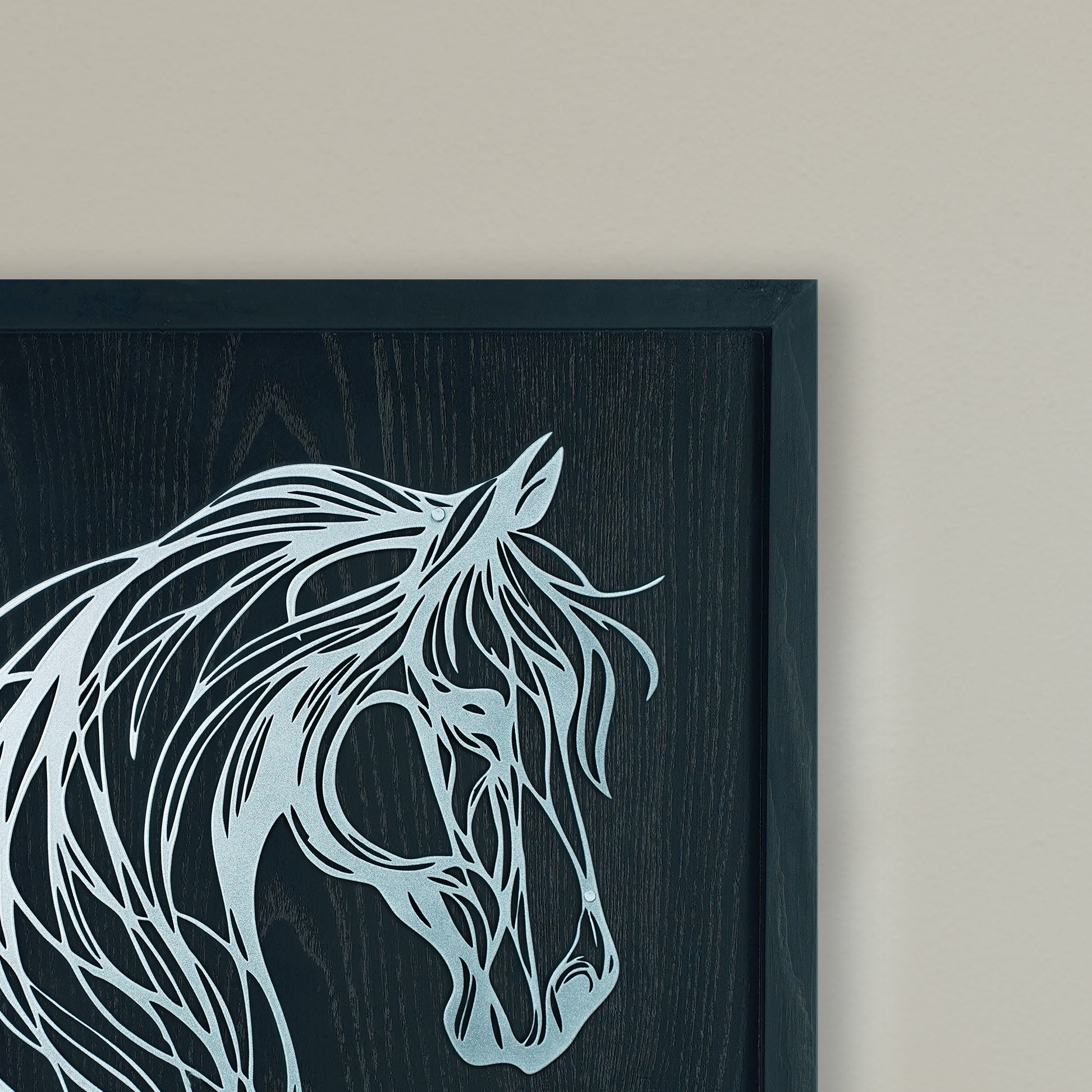 Framed artwork of a stylized horse head on a dark background