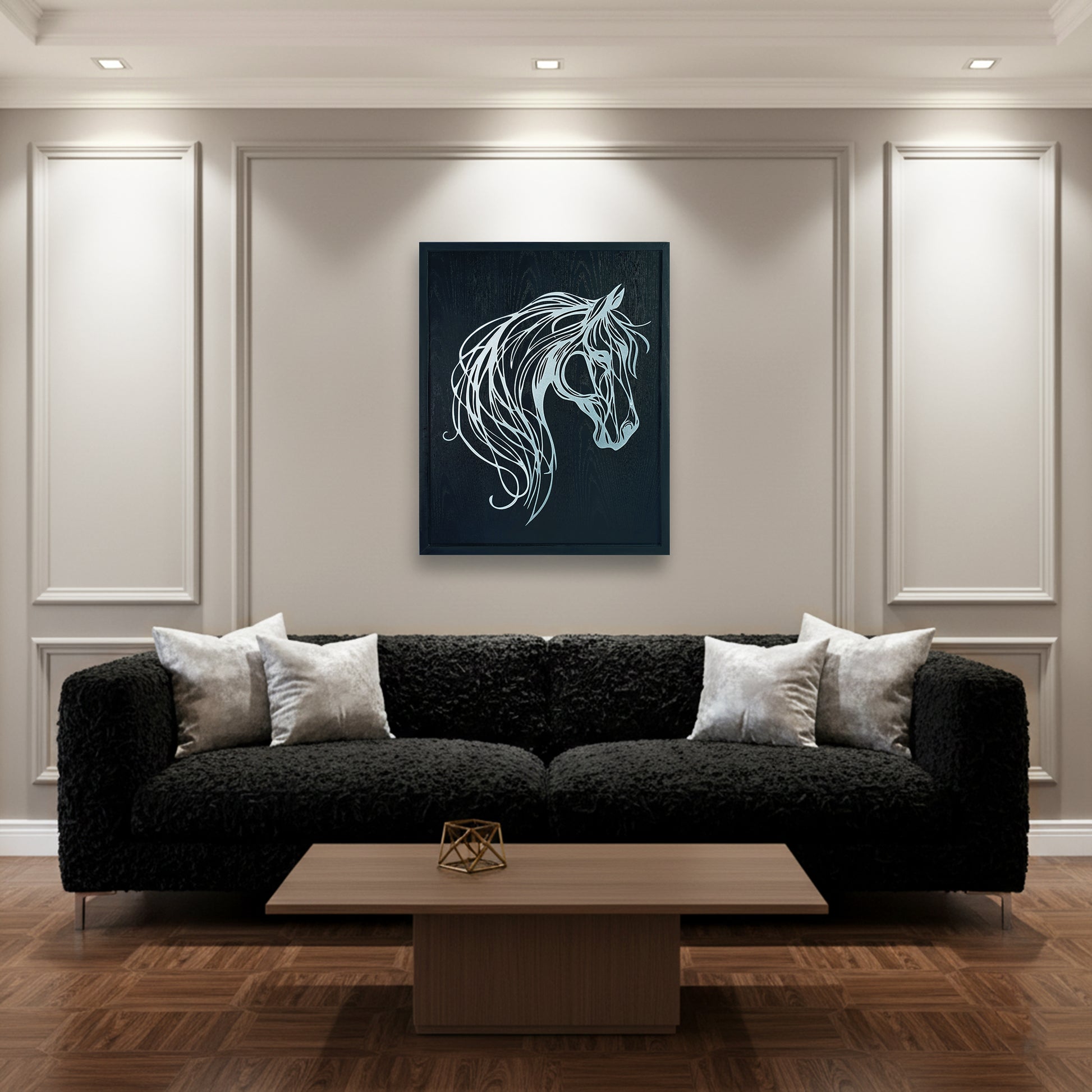 Modern living room with a black sofa, wooden coffee table, and abstract horse metal wall art.