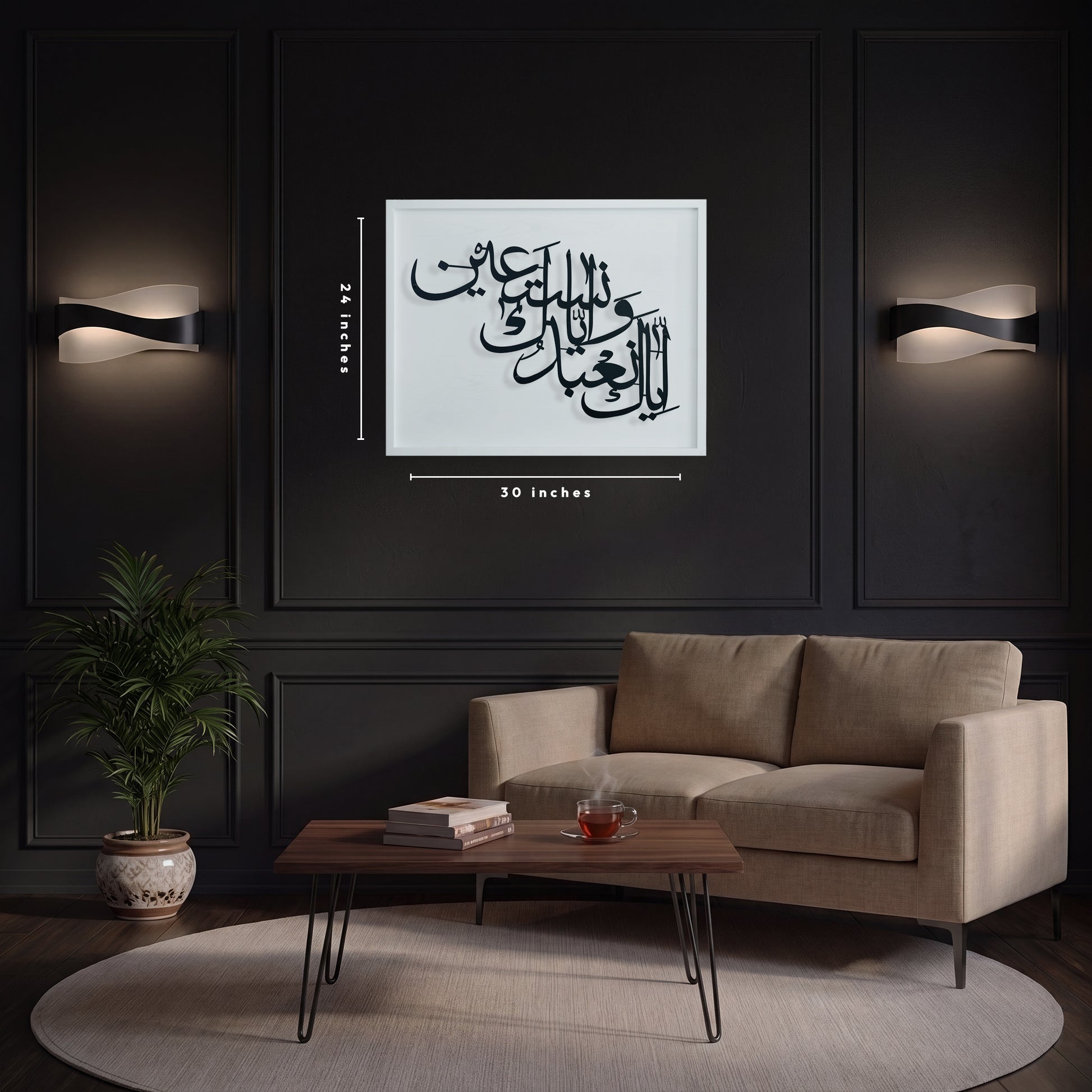 A framed black Arabic calligraphy metal wall art on white wooden frame is displayed on a dark paneled wall above a beige sofa in a modern living room. White dimension lines indicate the print is 30 inches wide by 24 inches high.